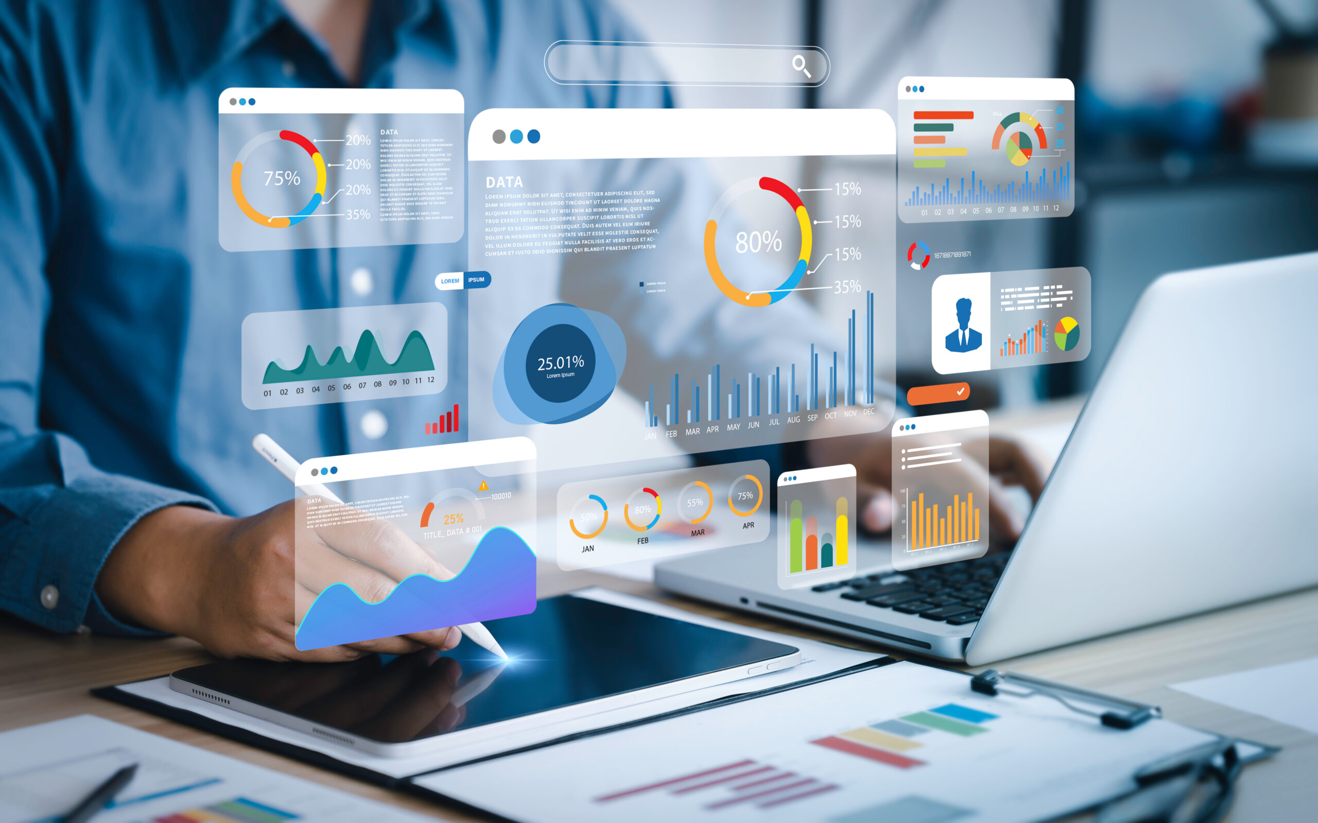 An analyst uses a computer and dashboard for data