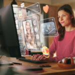 Young Beuatiful Women Using Desktop Computer To Check Social Media, Listen To Music and Read Emails. Creative Person Catching Up With Friends Online. 3D Visualization of Online Platforms Concept.
