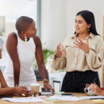 Diverse group, teamwork and young business women brainstorming, collaboration or cooperation. Ambitious confident professional team of colleagues talking and planning a marketing strategy together