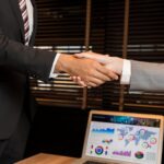 businessman and businesswoman shaking hands.