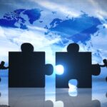 World Business teamwork puzzle pieces