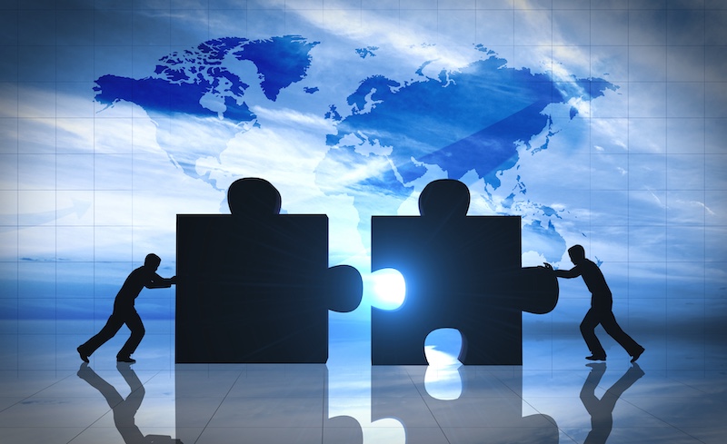 World Business teamwork puzzle pieces