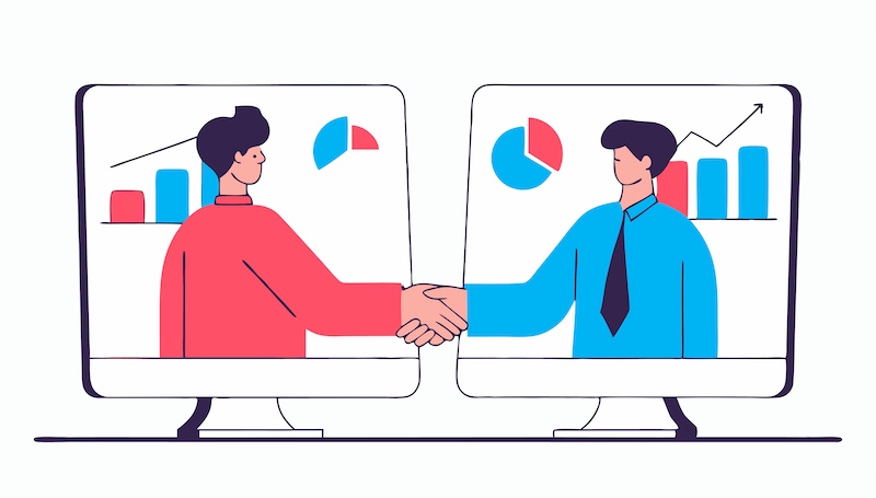 Two business professionals, one in red and one in blue, are shaking hands across two computer monitors, symbolizing a virtual business agreement or collaboration, with charts and graphs in the backgr