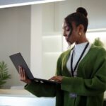 Aurasell Diverse Office Portrait of Black Businesswoman in office and thinking while working on laptop, Business marketing, social media update or networking, black woman, African female worker