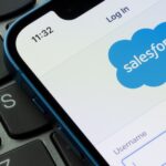 Salesforce Informatica Integration mobile app login page is seen on an iPhone. Salesforce is an American cloud based software company known for its CRM service platform.