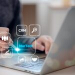 Martech marketing technology concept. Women use laptop Martech marketing on virtual screen interface.