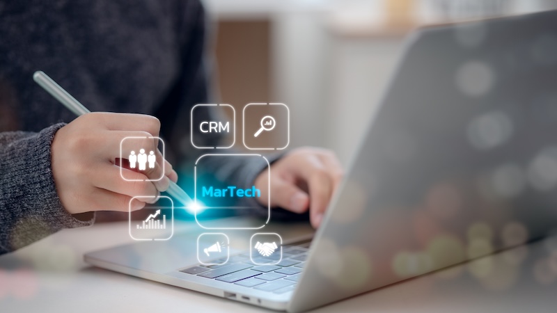 Martech marketing technology concept. Women use laptop Martech marketing on virtual screen interface.