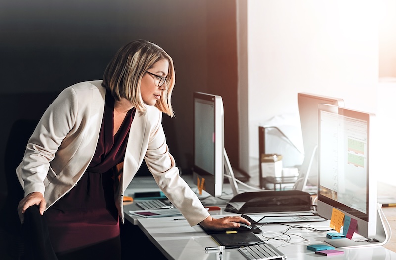 Aurasell AI GTM OS Computer, schedule and business woman in office planning, research or agenda, graph and solution. Pc, calendar or manager reading client feedback, review or b2b communication for project proposal