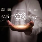 2026 Database Strategies & Contact Acquisition Benchmark Survey Marketing automation concept. Hand holding AI driven automated system with digital market, SEO, global data analytics, customer engagement platform, lead nurturing, auto workflow for advertising task