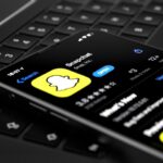Snapchat B2B Marketing application in AppStore, displayed on Future new iPhone 12 Pro concept in silver color home screen displayed, 3d illustration