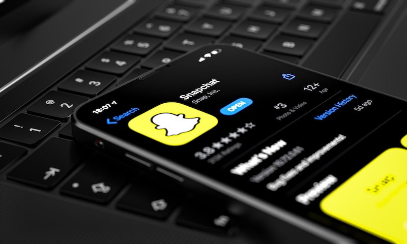 Snapchat B2B Marketing application in AppStore, displayed on Future new iPhone 12 Pro concept in silver color home screen displayed, 3d illustration