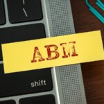 BambooBox ABM There is sticky note with the word ABM. It is an abbreviation for Account Based Marketing as eye catching image.