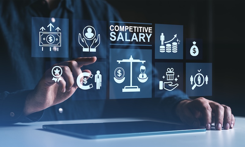 CaptivateIQ State of Incentive Compensation Management Report Businessman interacting with digital icons representing competitive salary and employee benefits on a futuristic interface in dark environment.