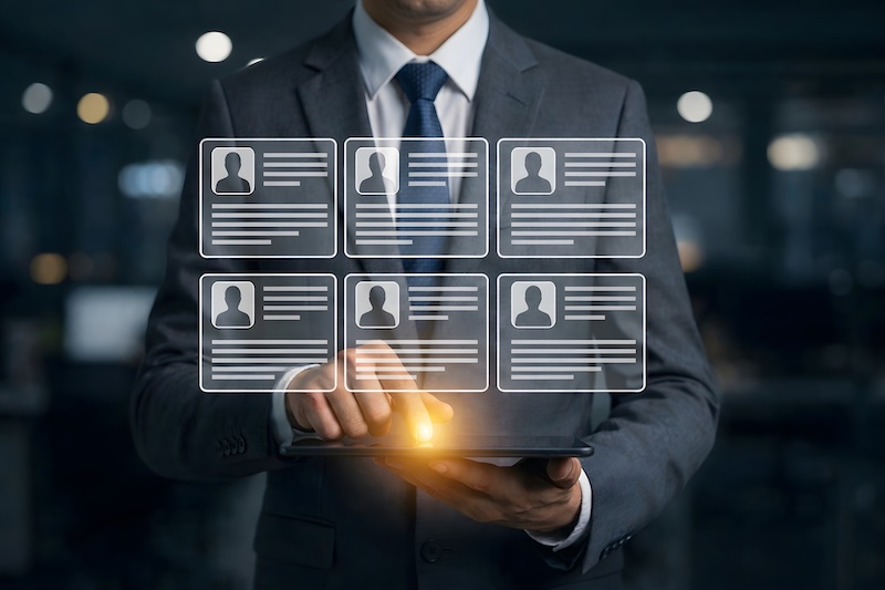 Day 2 #COSeries Human resources manager reviewing employee database and hiring shortlist interface