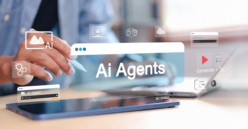 Iterable Launches AI Agent Business person using tablet with virtual AI agents interface overlay. Concept of artificial intelligence, automation, machine learning, chatbot, and digital transformation.