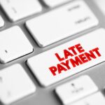 Kaplan Group Marketing Agency Late payment mount of money a borrower sends to a lender that arrives after the date that the payment was due, text button on keyboard