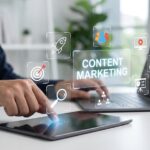 Brandpoint Content Marketing Person using tablet to manage content marketing strategy with interactive digital icons for audience targeting and creative media planning in modern office environment