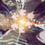 Infolinks Integrates with Basis Teamwork of partners. Concept of integration and startup with puzzle pieces