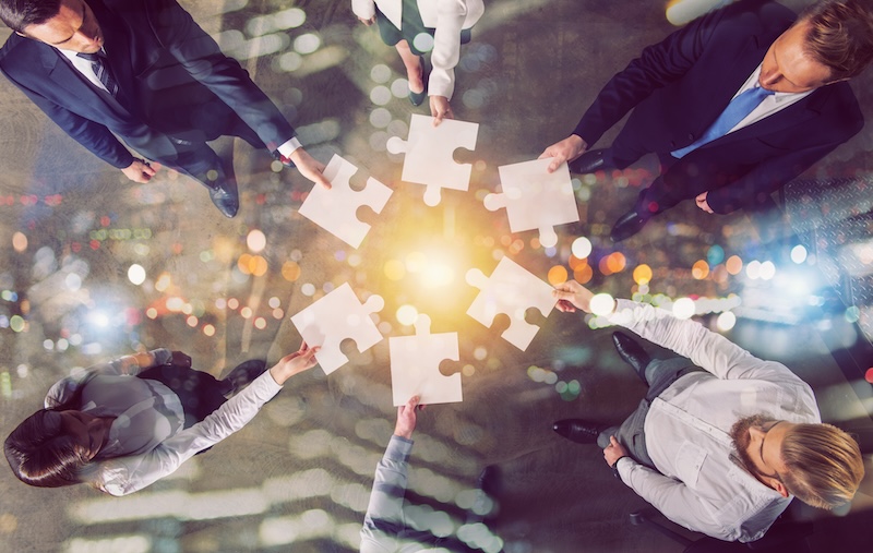 Infolinks Integrates with Basis Teamwork of partners. Concept of integration and startup with puzzle pieces