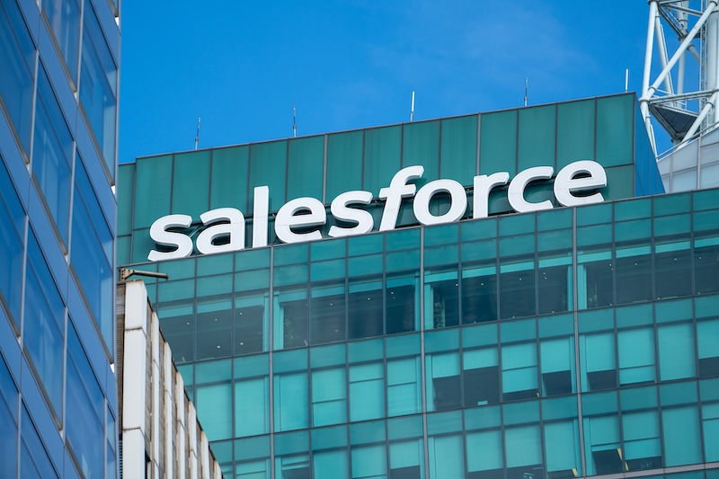 Salesforce Acquires Fin New York, USA November 23, 2025: High above a glass building near Bryant Park, the “salesforce” rooftop sign towers over New York City, symbolizing tech innovation within the iconic urban skyline.