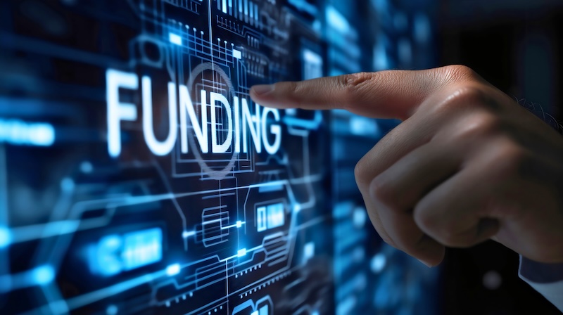 Sprouts.ai Funding Businessman hand finger touching the text funding on blue digital display screen. Market economy growth, company banking and money management concept. Corporate budget