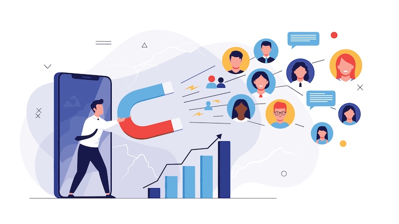 pharosIQ Launches atlasIQ B2B Audience Activation, DaaS Modern inbound marketing strategy concept showing professional using a giant magnet to attract potential customers through mobile technology.